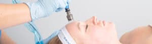 Aesthetic treatment with a syringe during a facial procedure at a luxury medspa in Brookhaven, GA.