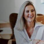 A friendly healthcare professional discusses wellness goals with a client in a comfortable clinic se.
