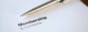 Close-up of a pen and membership form for wellness services.