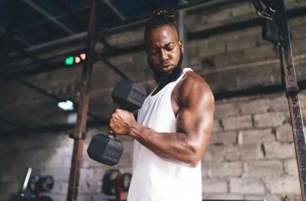 Man building strength with weights